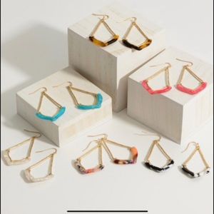 Gold teardrop earrings featuring Resin accents. Approximately 2.5” in le…